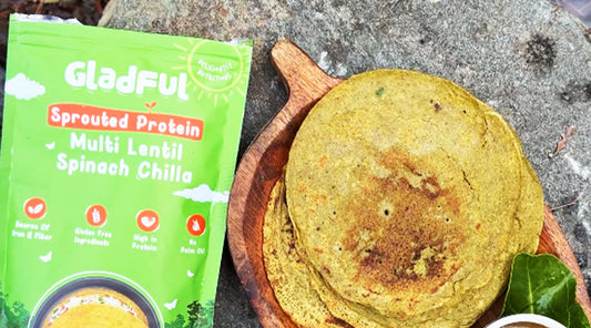 Delicious Variations of Spinach Chilla. A green coloured chilla packaging  next to a cooked chilla stack with chutney 