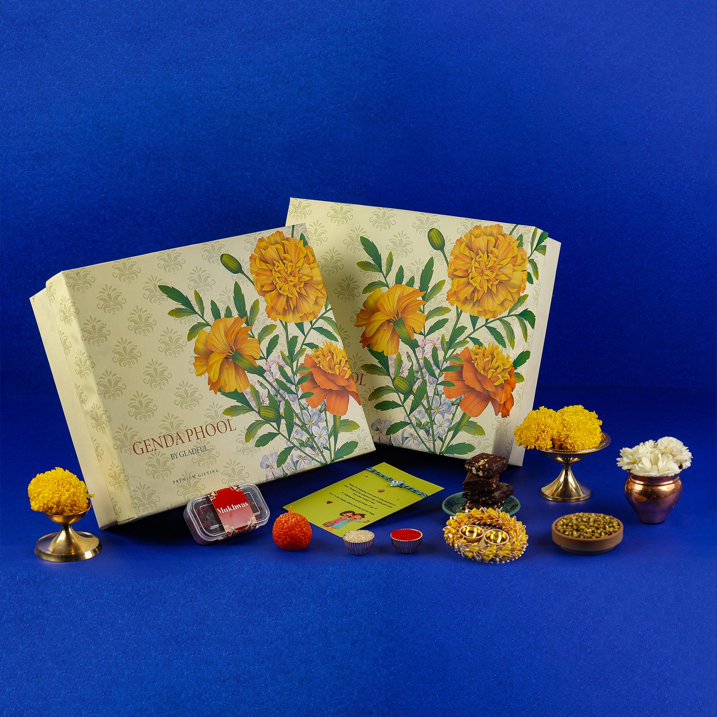 Sweet Rakhi Treasures Gift in Genda Phool by Gladful Box - 15 Products