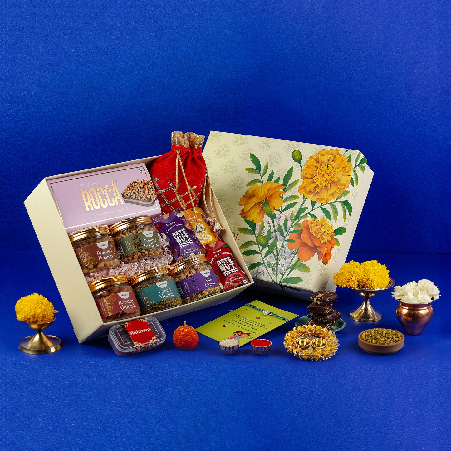 Sweet Rakhi Treasures Gift in Genda Phool by Gladful Box - 15 Products